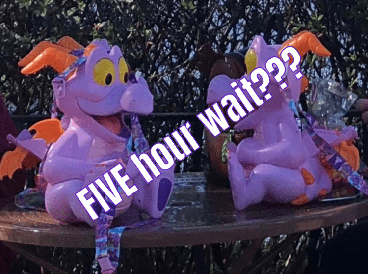Figment popcorn buckets rest on an EPCOT table, with bold text overlay declaring, “FIVE hour wait???”—a must-see moment for Disney fans and collectors who know the hype surrounding exclusive park merchandise.