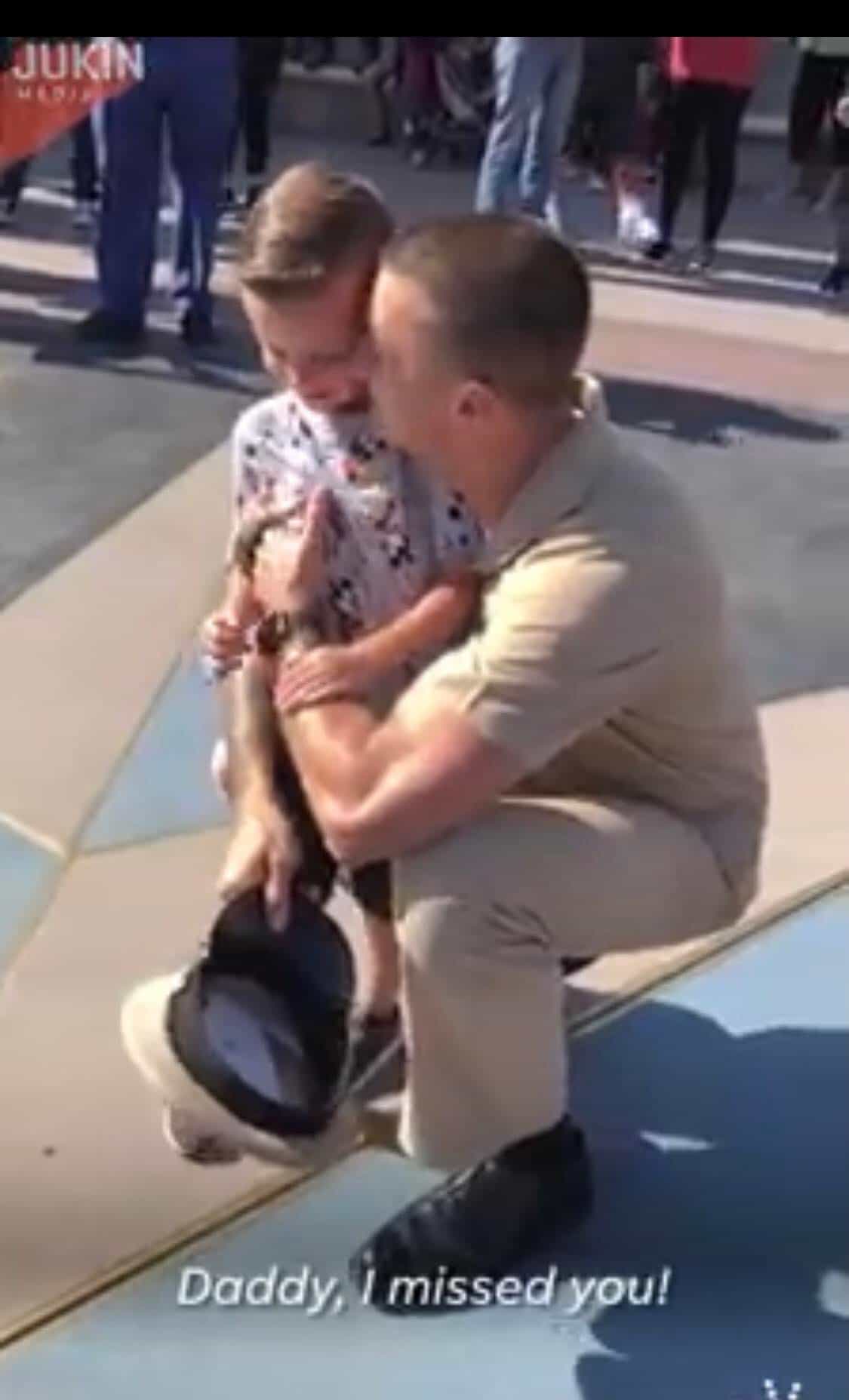 In this unforgettable Disneyland moment, a young boy receives the ultimate magical surprise—he rushes into the arms of his uniformed dad for a joyful, tearful hug. Their emotional reunion is surrounded by Disney magic, as the screen displays the heartfelt words: "Daddy, I missed you!.