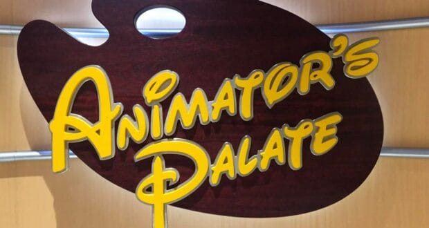 Animator’s Palate sign featuring vibrant yellow lettering on a brown artist’s palette backdrop, mounted on a beige wall aboard the Disney Cruise Line, highlighted in the Dining section of My Disney Cruise Line Experience During Covid Part 6.