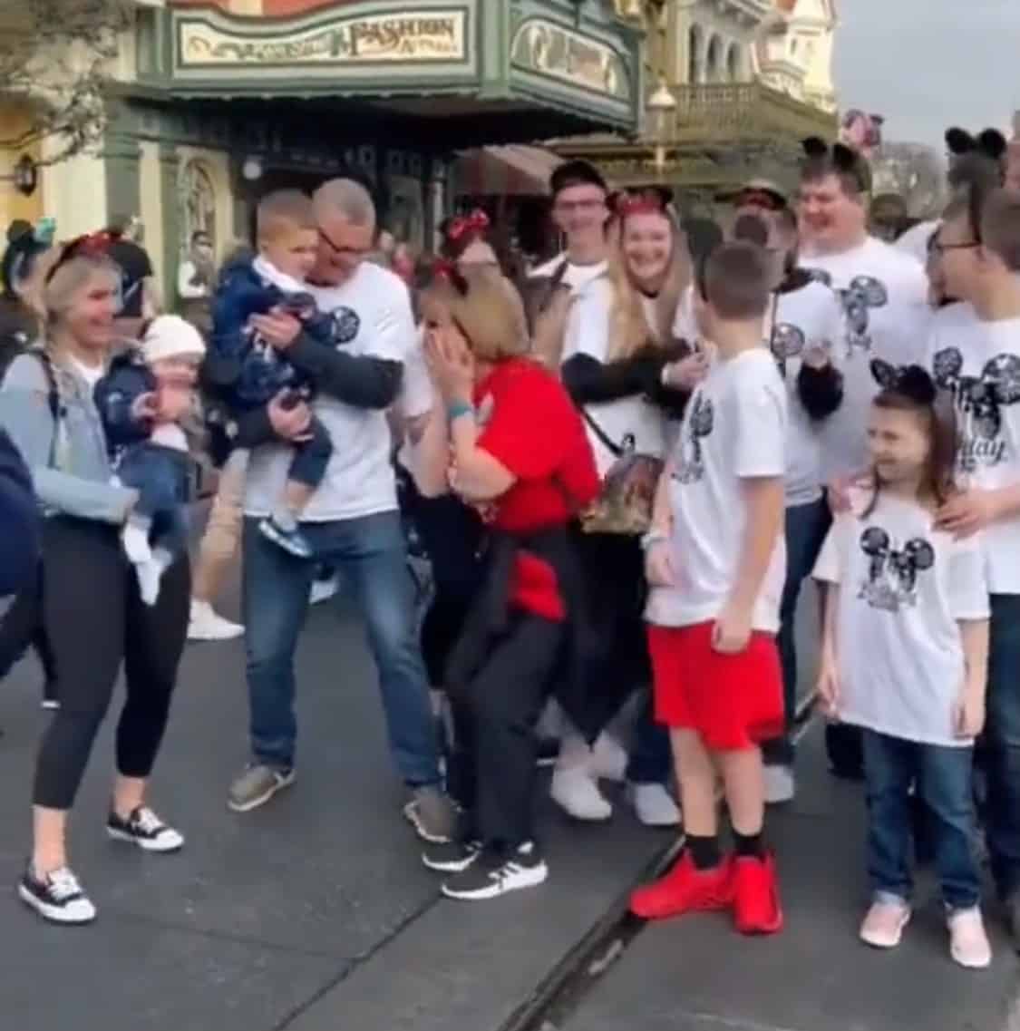 A joyful family wearing matching shirts gathers at Disney World, sharing laughter and hugs in front of iconic attractions. In this heartwarming video, the group surprises their matriarch on her 70th birthday, capturing the magical spirit of Disney as they celebrate and create treasured memories brimming with love and happiness.