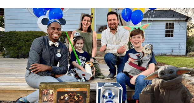 Star Wars characters, both adults and kids, gather with themed toys and big smiles outside a home, as Disney grants a Make-a-Wish child an unforgettable Star Wars adventure.