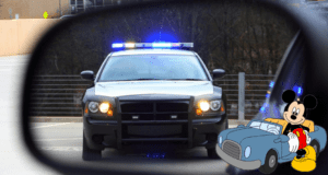 Mickey Mouse, behind the wheel of his classic cartoon car, is spotted in a side mirror with a flashing police cruiser right behind him—giving off major "Disney fun meets real-world speed limits on I-4 Express" vibes that many guests have experienced after leaving the magic.