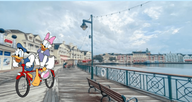 Donald and Daisy Duck pedal a colorful Surrey Bike along a quiet Disney World boardwalk with scenic waterfront views and resort buildings in the distance, capturing the whimsical fun of renting bikes at Disney World Resorts.