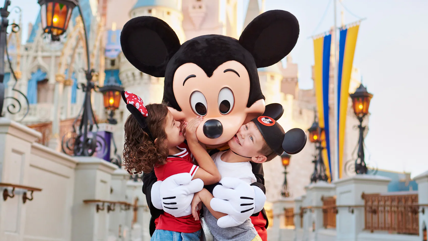 mickey mouse hugging kids