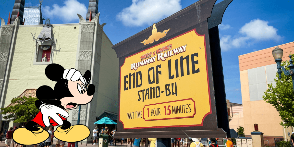 Mickey Mouse appears weary as he stands beside the “Runaway Railway End of Line” sign displaying a 75-minute wait, capturing the bustle and excitement that come with experiencing Disney World’s most popular attractions during peak times.