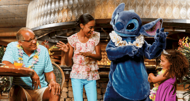 A family enjoys a joyful moment with Stitch at a lush, tropical Disney attraction, evoking the excitement of favorite character meet-and-greets before COVID-19.