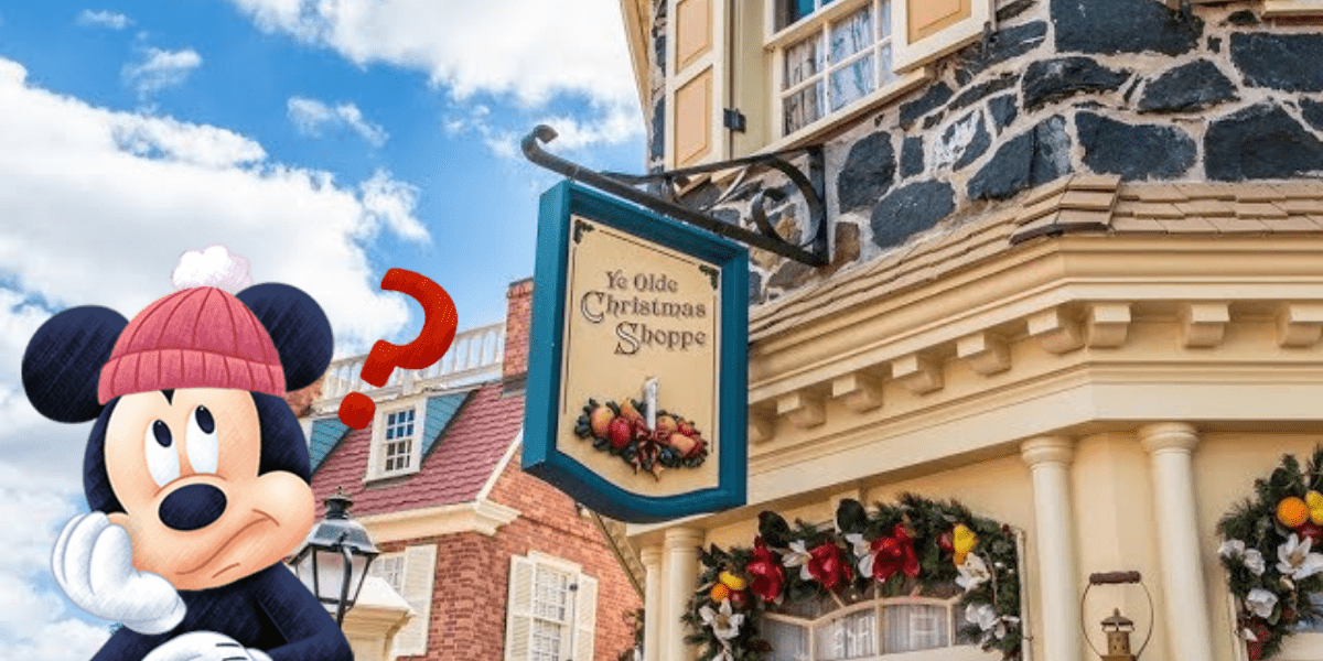 Mickey Mouse strikes a puzzled pose outside Ye Olde Christmas Shoppe at Disney World, surrounded by festive garlands and sparkling Disney Christmas Ornaments, while the windows overflow with magical Disney merchandise perfect for holiday shopping.