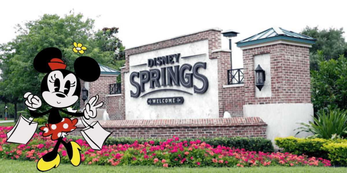 Minnie Mouse shows off her latest Disney Springs shopping spree, holding colorful bags full of Disney merchandise in front of the iconic welcome sign and surrounded by bright, cheerful flowers.