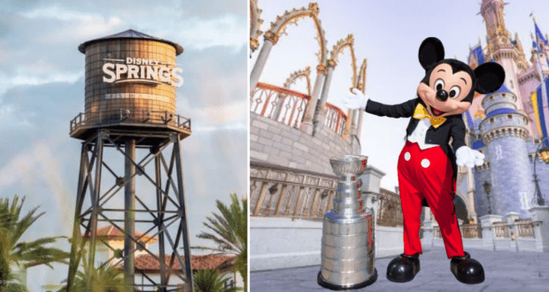 Mickey Mouse poses next to the Stanley Cup trophy in front of a Disney Springs water tower and a grand castle, all beneath a bright blue sky.
