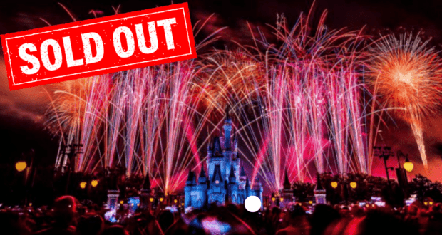 Spectacular fireworks soar above Cinderella Castle at Magic Kingdom, illuminating the night sky and the festive crowd celebrating 4th of July. A bold red "SOLD OUT" stamp stretches across the top, signaling the exclusive nature of this iconic Disney celebration.