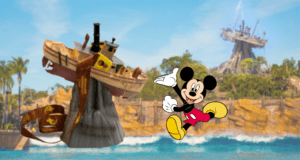 Mickey Mouse excitedly points toward the iconic Miss Tilly Sipper boat perched on a rock, with the vibrant attractions and sparkling waters of Disney’s Typhoon Lagoon stretching out in the background.