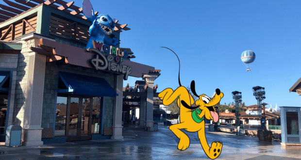 The iconic World of Disney store featuring Stitch perched mischievously above the entrance, while Pluto dashes by in true runDisney spirit. A festive balloon floats overhead, capturing the magic of Disney Springs.