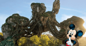 The floating mountains of Pandora, covered in lush greenery, tower in the background, bringing the magic of Disney’s Animal Kingdom to life as Mickey Mouse stands in the foreground, holding a finger to his lips for a playful shh.