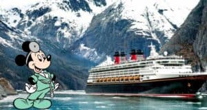 Mickey Mouse, dressed as a friendly doctor, stands beside a grand Disney Cruise ship set against snowy mountains, ready to share the latest cruise testing updates with eager Disney fans preparing for their magical adventure.