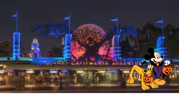 Disney California Adventure shimmers under Halloween lights at night, with Mickey Mouse and Pluto—each holding pumpkin buckets—welcoming guests to the lively Oogie Boogie Bash celebration.