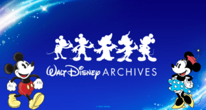 Mickey and Minnie Mouse stand together in front of a lineup of classic Mickey silhouettes, with "Walt Disney Archives D23" displayed on a vibrant blue backdrop, capturing the magic and history celebrated by Disney fans.