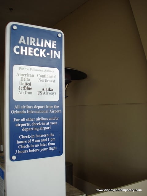 Airline check-in sign at Orlando International Airport displays airlines and their check-in times, helping theme park guests headed to Disney World and other major attractions coordinate arrival times for a smooth start to their adventure-filled vacation.
