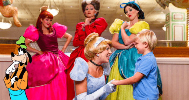 Cinderella warmly greets a young boy, surrounded by Disney World favorites like princesses and Goofy, all gathered together in a dazzling, ornately decorated room.