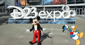 Mickey Mouse greets fans in front of the vibrant D23 Expo sign, while Donald Duck appears alongside him, bringing Disney magic and excitement to this special event for theme park and entertainment lovers.