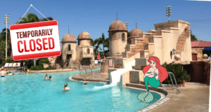 A “Temporarily Closed” sign is displayed at a Disney Resort pool, where Ariel from The Little Mermaid sits beside the water, evoking the playful atmosphere fans expect from Disney destinations.