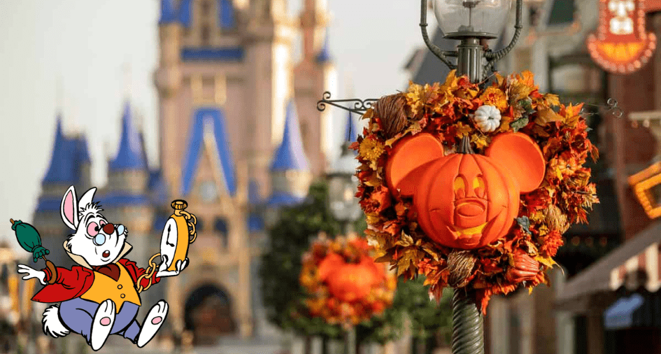 A festive Mickey-shaped pumpkin wreath brightens Main Street near Cinderella Castle, celebrating the enchanting Halloween vibes of Magic Kingdom’s grand opening, while the White Rabbit character from Alice in Wonderland clutches his signature pocket watch nearby.