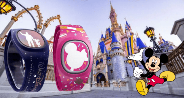 Two Disney MagicBand+ bracelets on display with Cinderella Castle in the background at Walt Disney World, as Mickey Mouse waves to guests on the right.