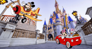 A whimsical plane soars past Cinderella Castle as Goofy and Donald Duck cruise by in a classic red car with Mickey Mouse along for the ride, evoking the excitement of an adventure on the way to Disney World.