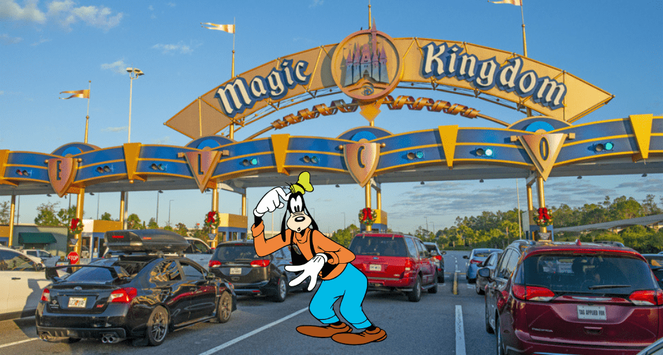 Goofy greets guests among parked cars at Disney World's Magic Kingdom entrance, welcoming everyone with his signature charm on a bright, sunny day.