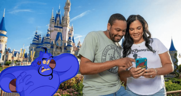 Guests smile at their phone in front of Cinderella Castle, with the Disney Genie+ character appearing beside them.