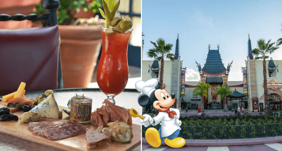 Charcuterie and a refreshing drink set on a table at the Hollywood Brown Derby Lounge, with Mickey Mouse in his chef hat greeting guests near the iconic theme park entrance lined with palm trees.