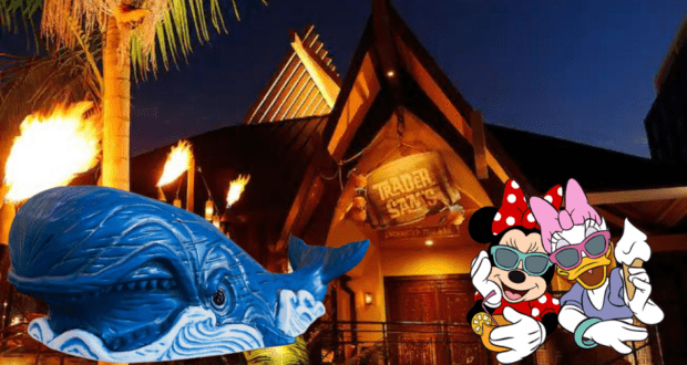 The giant blue whale statue joins Minnie Mouse and Daisy Duck, both rocking sunglasses, as they show off a Monstro Tiki Mug from Trader Sam’s tiki bar under the nighttime lights.