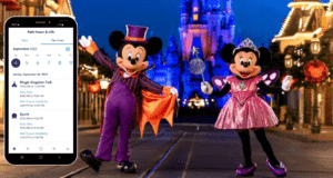 Mickey and Minnie Mouse dressed in playful Halloween costumes pose beside a smartphone showing Disney World Park Hours and essential visitor information.