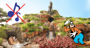 Entrance to a log flume ride featuring a sign that playfully bans the Splash Mountain Soundtrack, with a cartoon dog character and whimsical cartoon thorns setting the scene.