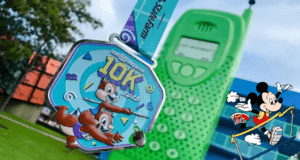 Disney 10K medal featuring Chip and Dale, a playful green toy phone, and Mickey Mouse triumphantly crossing the finish line—a fun tribute to the creative spirit of Walt Disney World Marathon Weekend Medals.