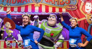 Buzz Lightyear and Jessie greet fans alongside two guests in blue costumes at a Toy Story-themed runDisney Springtime Surprise event.