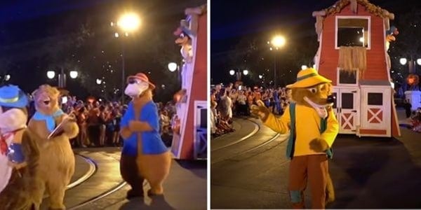 Beloved Disney characters make their way through Magic Kingdom at night, dazzling guests as they parade past crowds and a brightly lit red barn float, celebrating the final appearance of Splash Mountain in the Boo To You Parade.