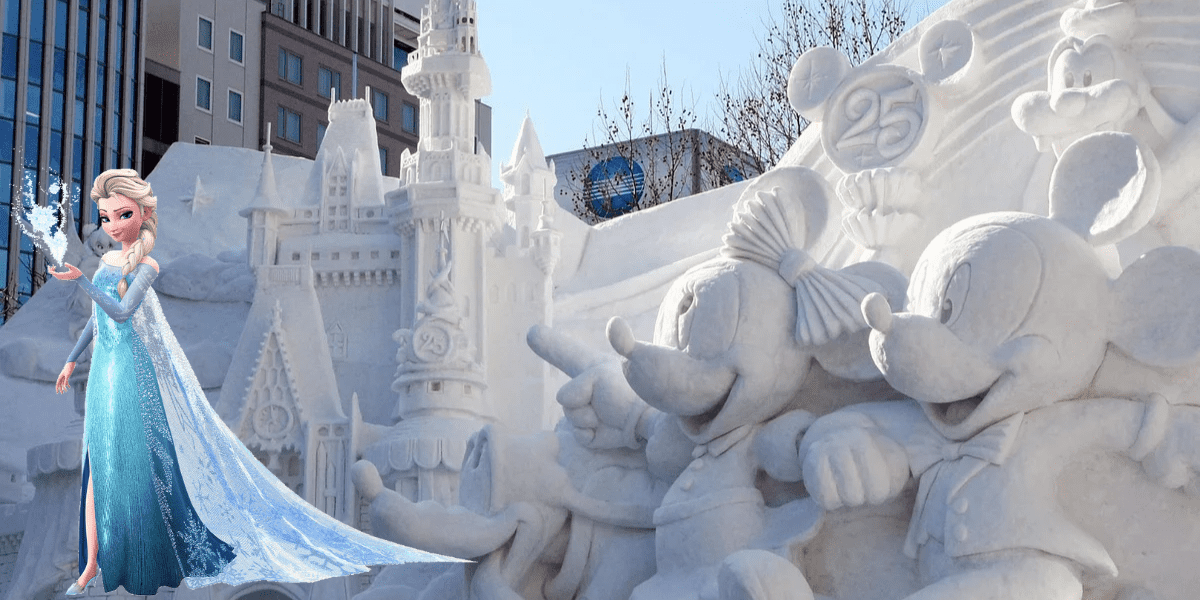Elsa poses beside intricately sculpted snow figures of Mickey and Minnie Mouse, along with a snowy Disney castle, all set against a city backdrop glowing in sunlight—capturing the enchanting holiday spirit that feels right at home in a Disney theme park’s festive winter celebration.