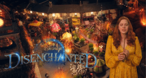 Giselle in a bright yellow dress stands before a lively, storybook-inspired village backdrop, with the "Disney Disenchanted Trailer" title displayed above.
