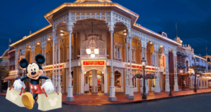 Mickey Mouse, holding reusable shopping bags, stands excitedly in front of the glowing Disney Emporium at night, ready to check out the latest exclusive Disney Parks Collector’s Item.