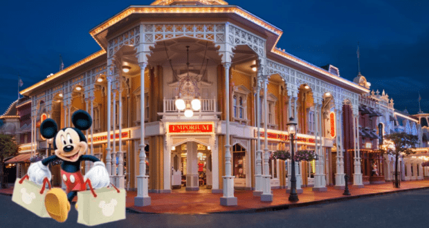 Mickey Mouse, holding reusable shopping bags, stands excitedly in front of the glowing Disney Emporium at night, ready to check out the latest exclusive Disney Parks Collector’s Item.
