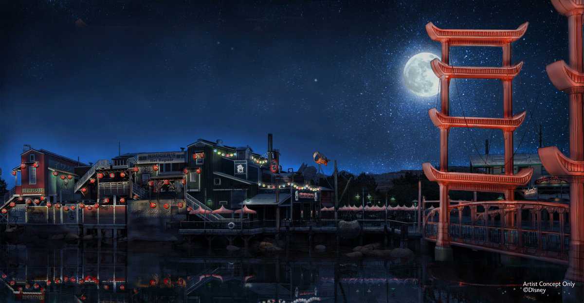 The San Fransokyo waterfront dazzles at night with glowing lanterns, iconic red torii gates, and a luminous full moon above the sparkling bay, capturing the lively spirit of an immersive theme park experience.