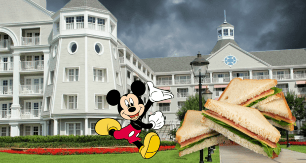 Mickey Mouse helps distribute Hurricane Ian relief meals and sandwiches outside a grand, gray Disney Resort hotel under overcast skies, highlighting Disney World’s dedication to supporting the community.