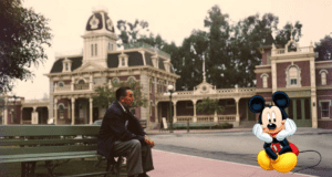 Mickey Mouse sits on a bench outside a charming vintage building, capturing the whimsical atmosphere guests experience near the Walt Disney statue at Disney World.