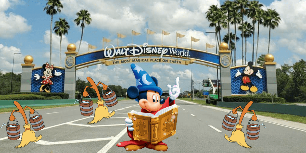 Mickey Mouse dons his iconic wizard robe and hat, reading a spellbook right by the Walt Disney World entrance, surrounded by lively enchanted brooms and buckets, bringing to life the magical atmosphere every Disney fan dreams of experiencing.