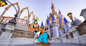 Goofy strikes a playful pose in front of Cinderella Castle, its blue and gold spires gleaming, perfectly embodying the whimsical charm and sometimes bewildering enchantment of a Disney vacation.