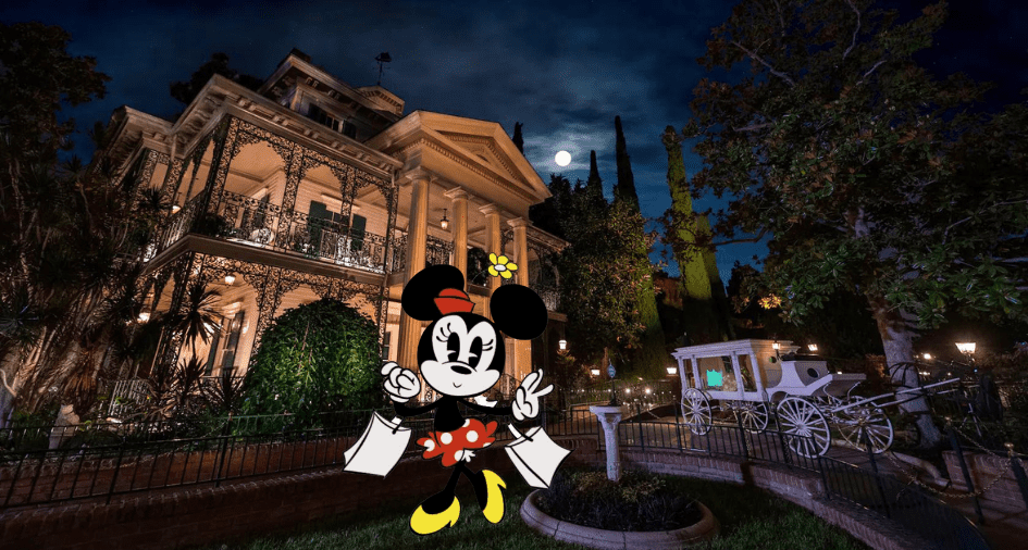 Minnie Mouse poses in front of the Haunted Mansion at night, illuminated by moonlight, with a white carriage on the lawn and showing off her exclusive Trader Sam's Haunted Mansion Mug.