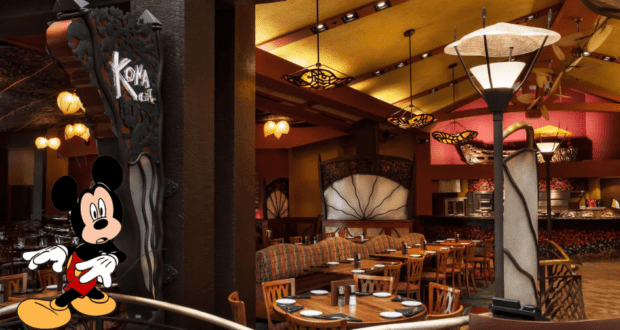 Mickey Mouse cheerfully greets visitors by the entrance of the warmly lit Kona Cafe, surrounded by inviting empty tables and cozy seating inside Disney’s Polynesian Village Resort.