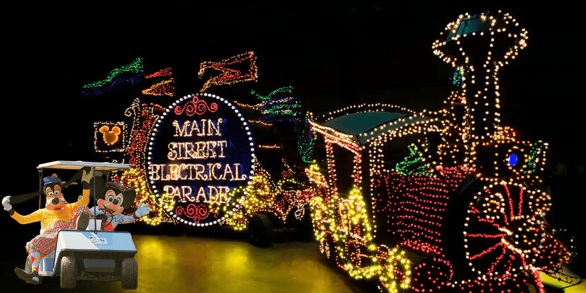 The Main Street Electrical Parade train glimmers in the night at Walt Disney World, its signature sign illuminating the enchantment of the park. Nearby, Goofy and Max beam from their golf cart, looking ready to join in the dazzling nighttime celebration.