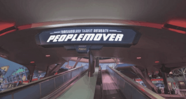 The PeopleMover sign welcomes guests above the escalators in Tomorrowland at Magic Kingdom, featured in the PeopleMover Florida Theme Park Injury Report.