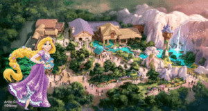 Rapunzel greets fans at Tokyo Disney’s Tangled area, with her iconic tower rising above enchanting fantasy buildings, cascading waterfalls, and bustling park guests enjoying the magical atmosphere.